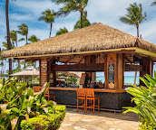 Thatched-roof beach bar at Beach Villas