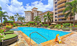 Beach Villas swimming pools surrounded by palms and gardens